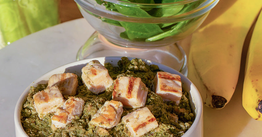 A fresh meal in a bowl next to other clean and fresh ingredients